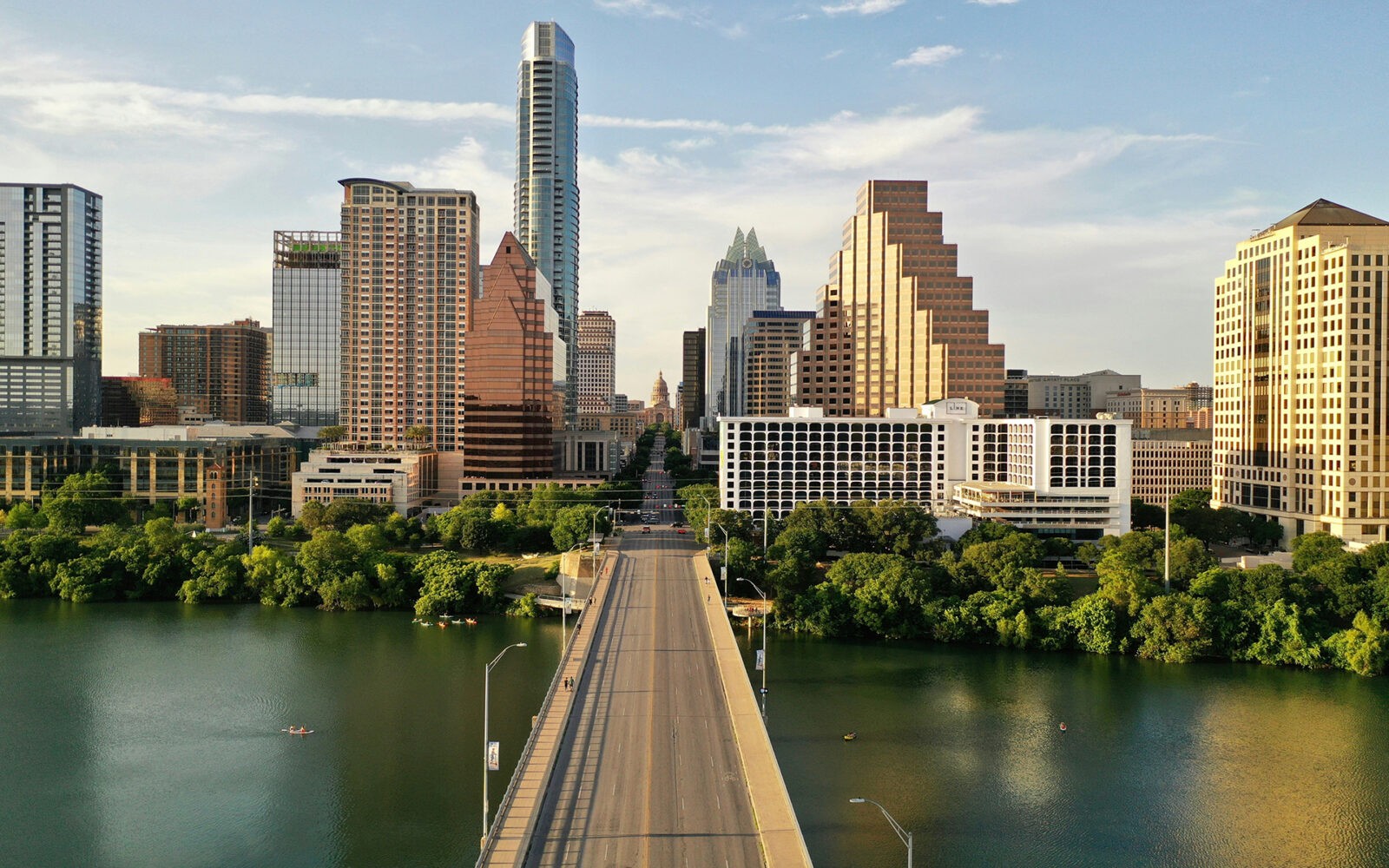 CloudMasonry - Texas Based Salesforce Consulting - Austin Office Landing Page Image - Austin skyline with Congress Avenue Bridge view