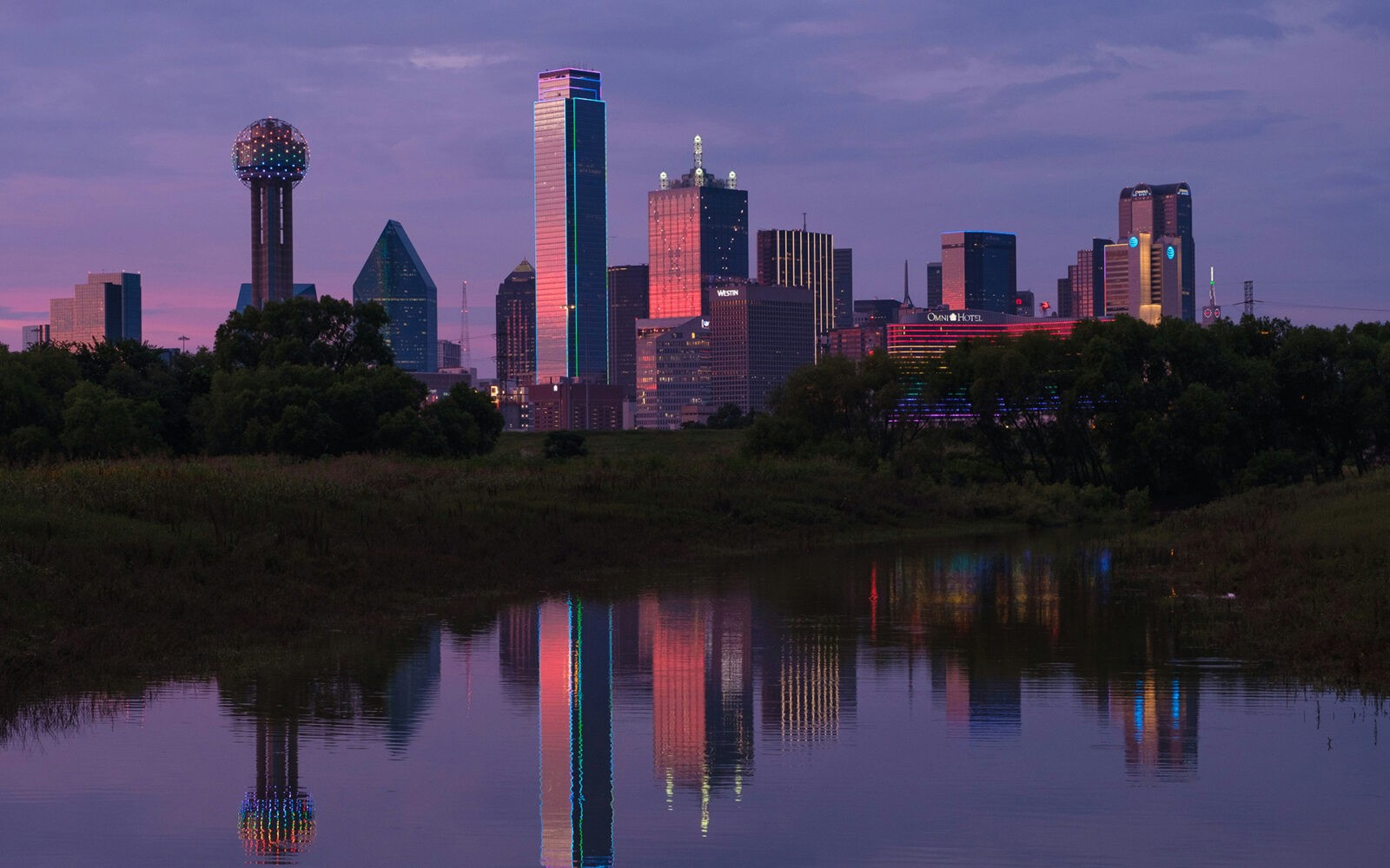 CloudMasonry - Texas Based Salesforce Consulting - Dallas Office Landing Page Image - Dallas skyline reflected in water at sunset